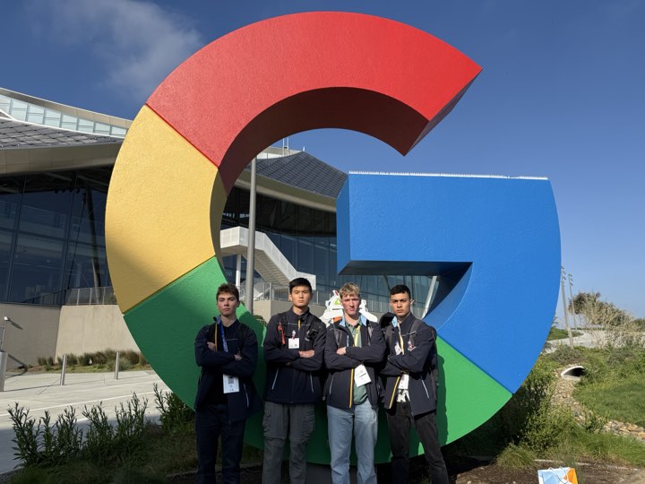Team photo in front of the Google sign at the Googleplex
