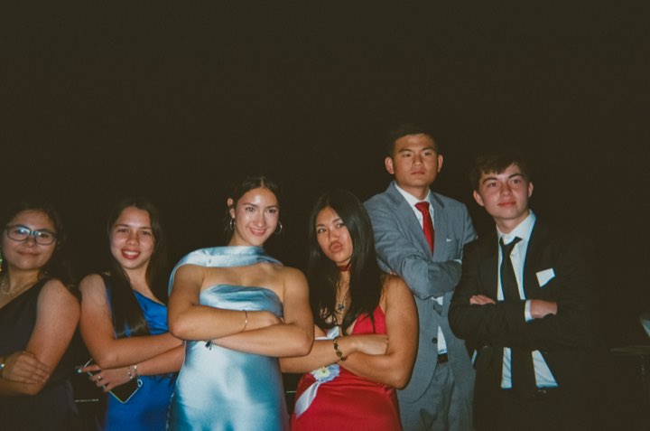 The crew dressed up at the formal, on film