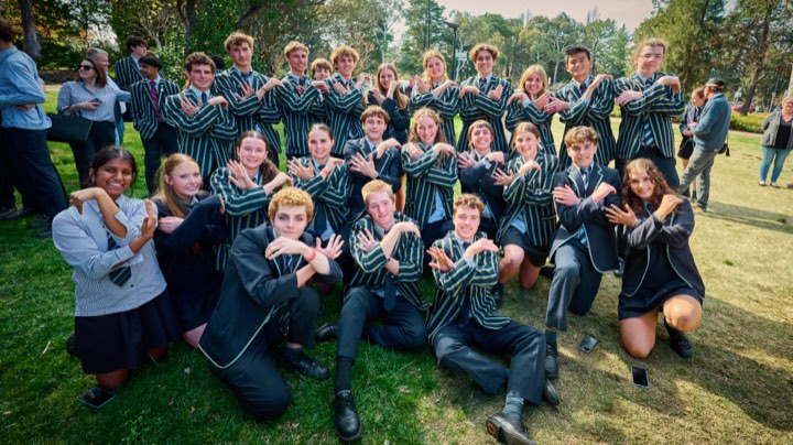 Blaxland House class of 2025-26 on the lawn doing the CGS hand sign