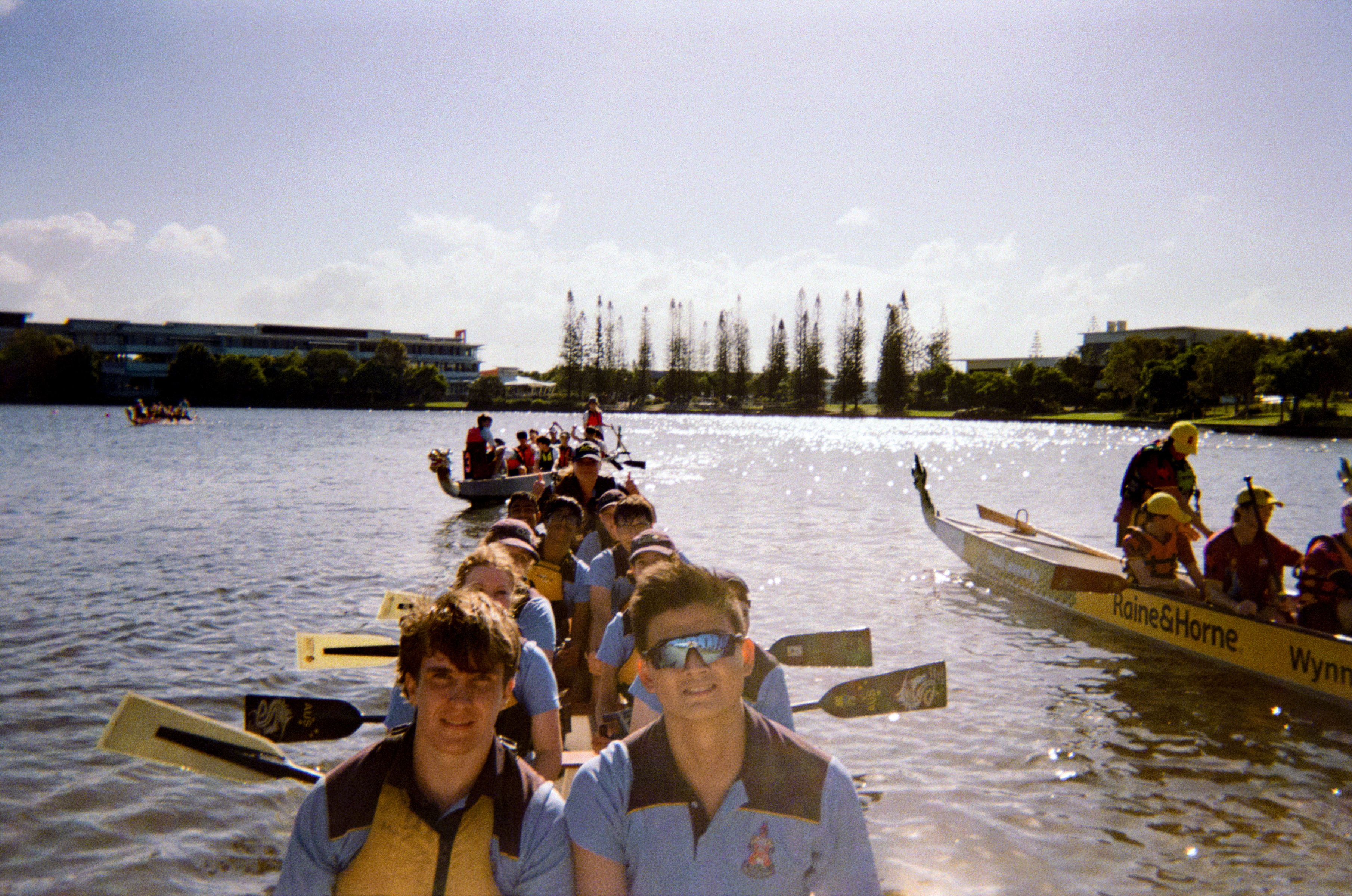 Crew powering forward, shot from the bow on film